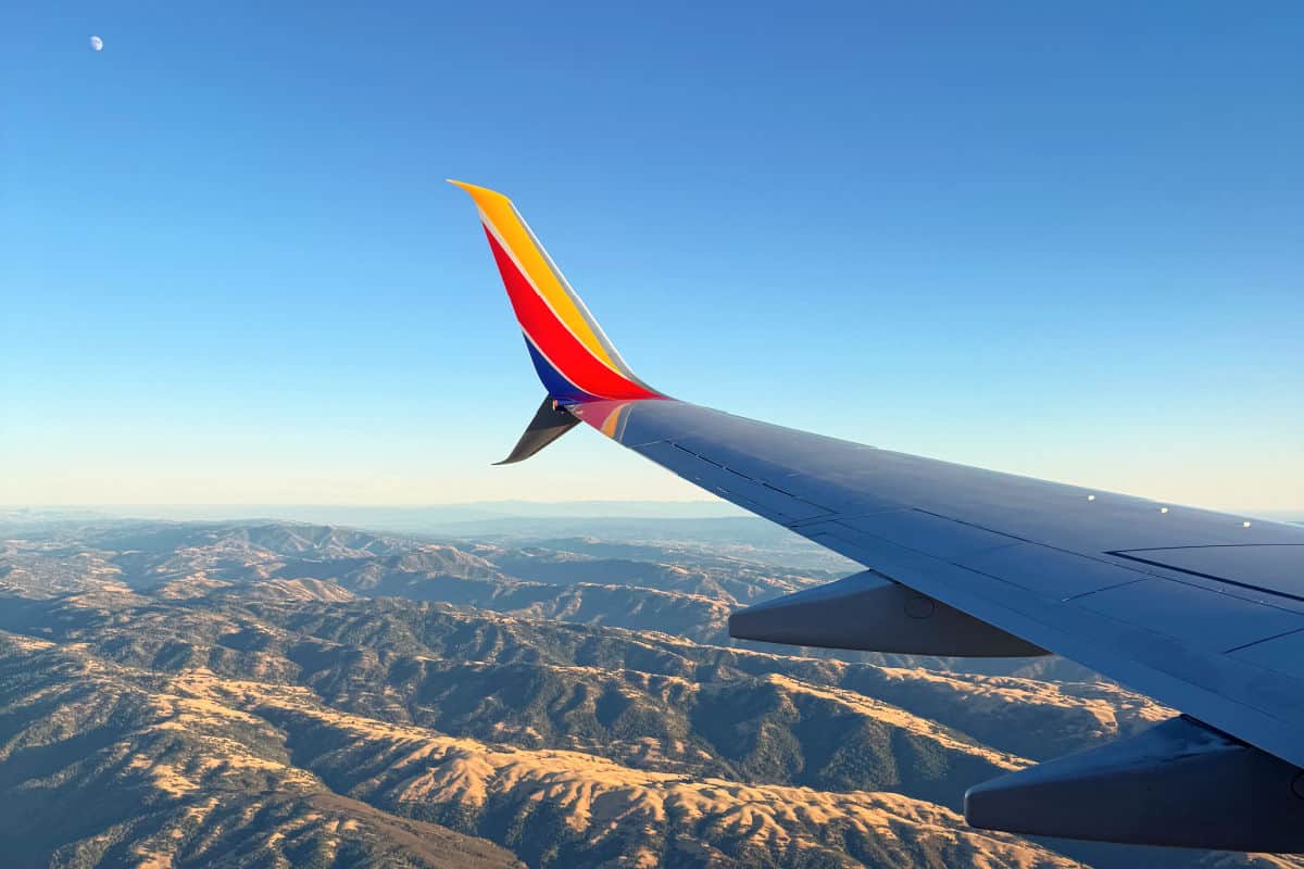 Southwest Wingtip Over Rugged Hills
