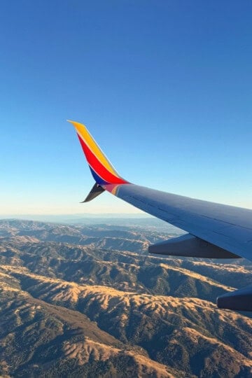 Southwest Wingtip Over Rugged Hills Square